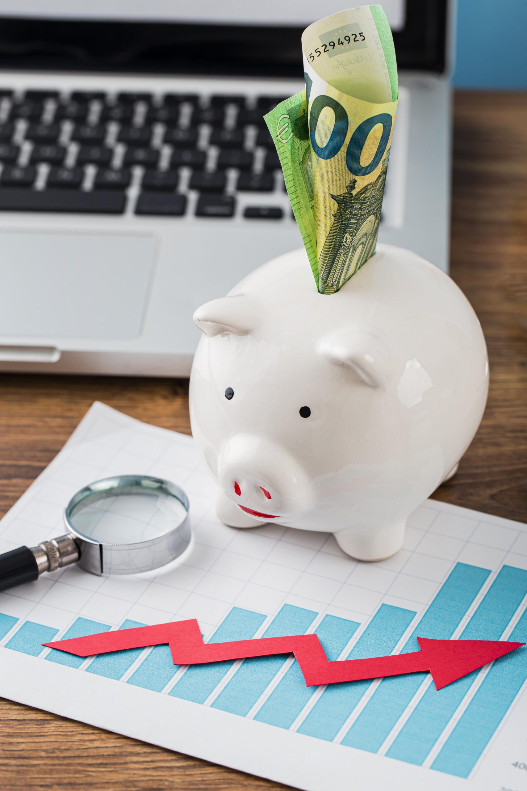 high-angle-office-items-with-piggy-bank-growth-chart.jpg