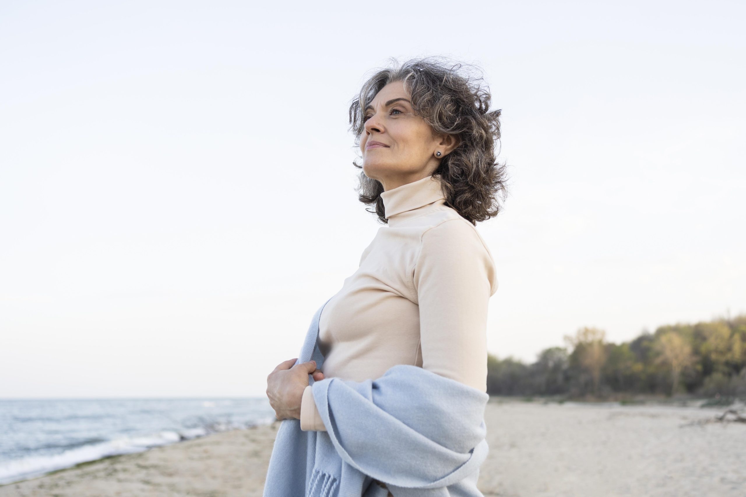 older-woman-enjoying-her-time-beach.jpg